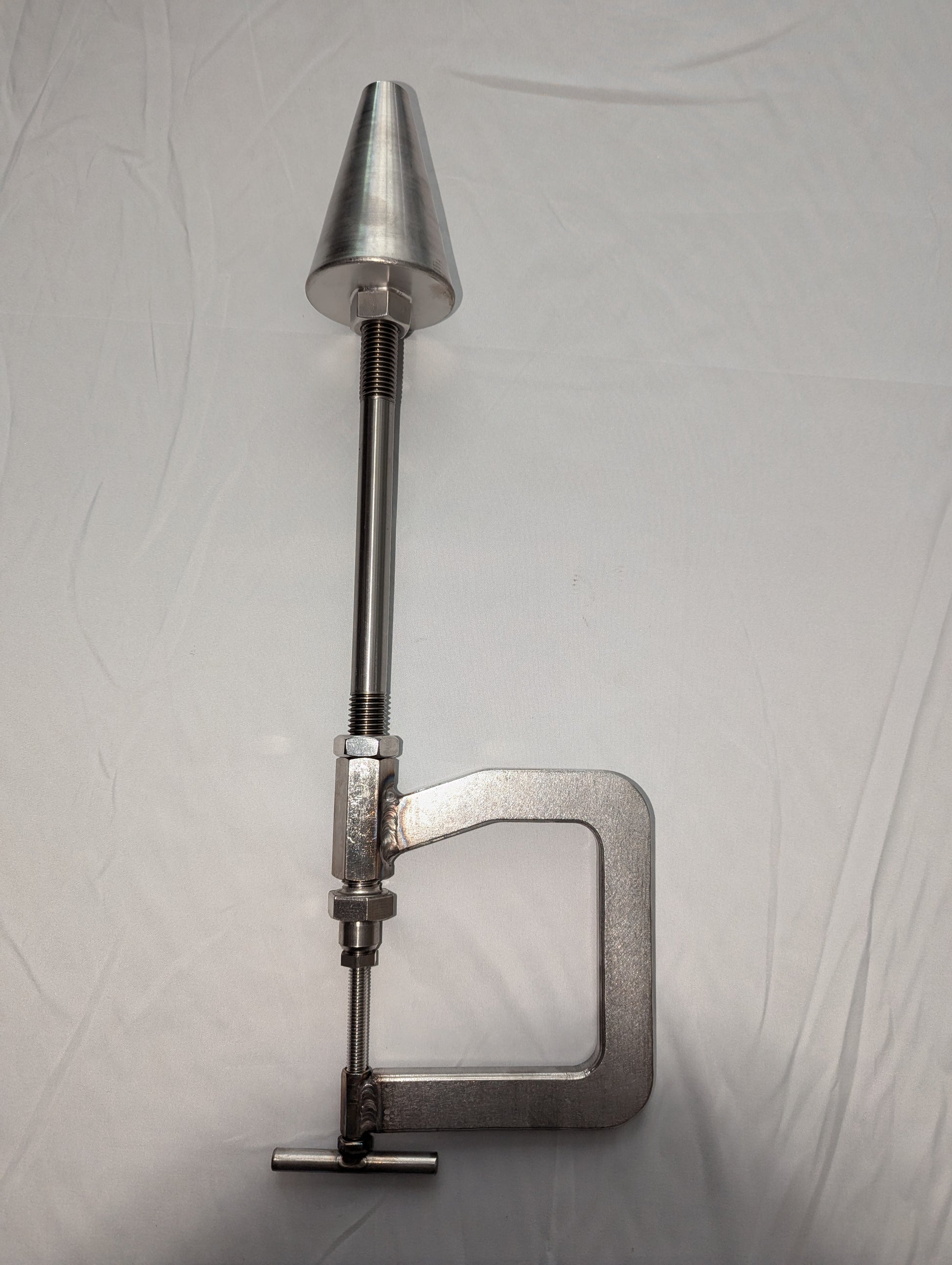 Cluck Clamp - Poultry Cut-up Cone and Clamp securely attached to a table, crafted from high-quality 304 stainless steel.